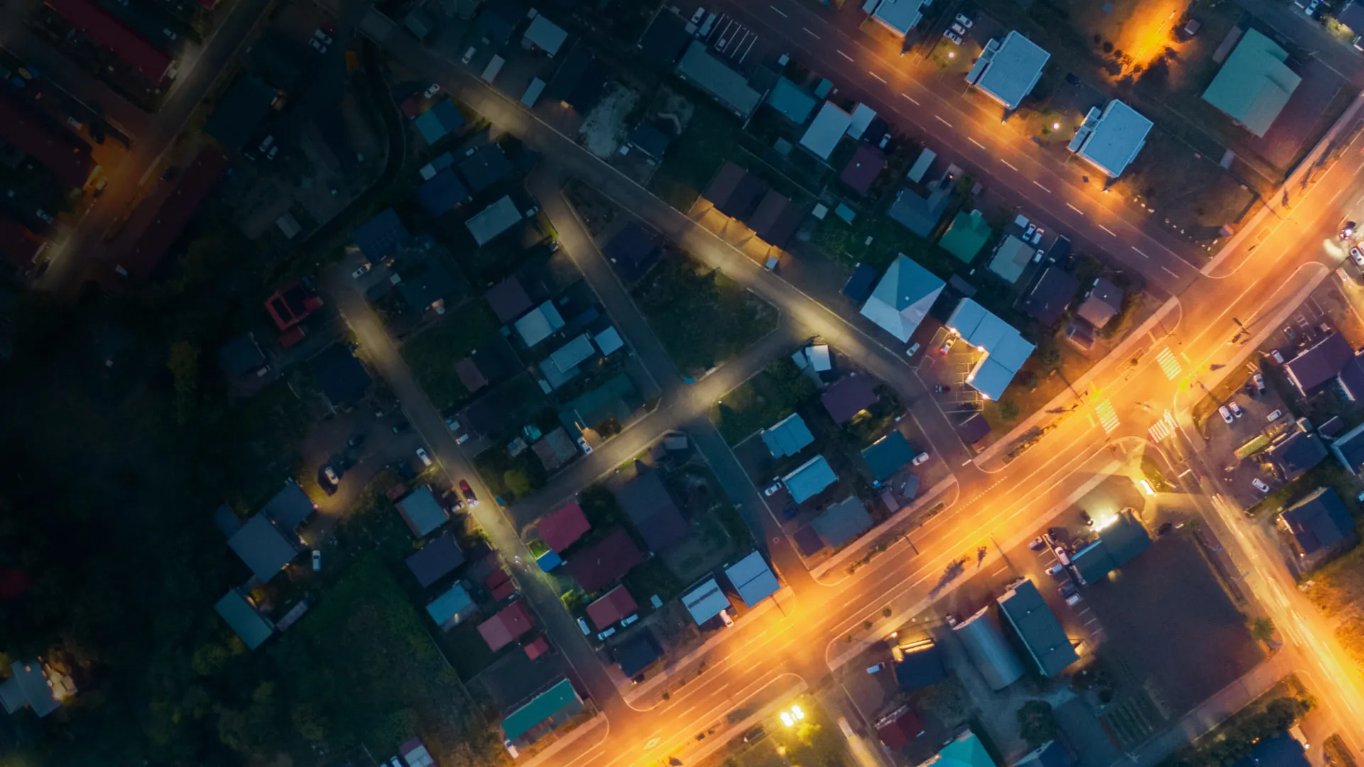 Bird's-eye view of city streets lit up at night