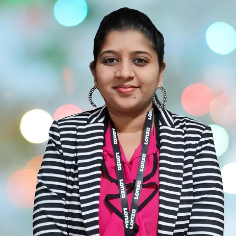 Portrait shot of a Madhu smiling to camera